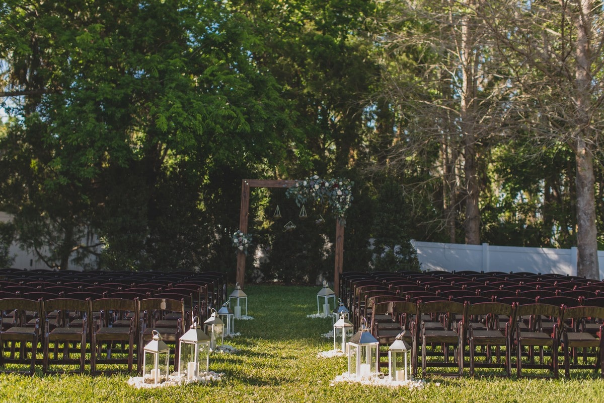 Luxmore Grande Estate - wedding ceremony set up with rustic wooden arch