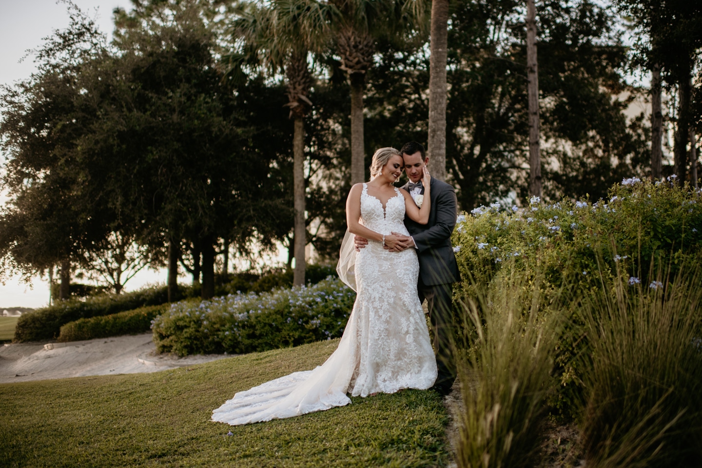 Omni Orlando Resort at ChampionsGate - bride and groom on lush golf course grounds