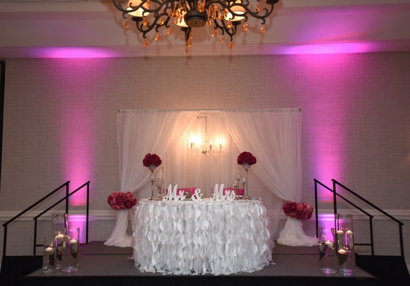 Renaissance Orlando Airport Hotel - sweetheart table on stage with ruffled tablecloth