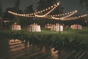 Rentaland Tents and Events - market lighting strung up over outdoor event space