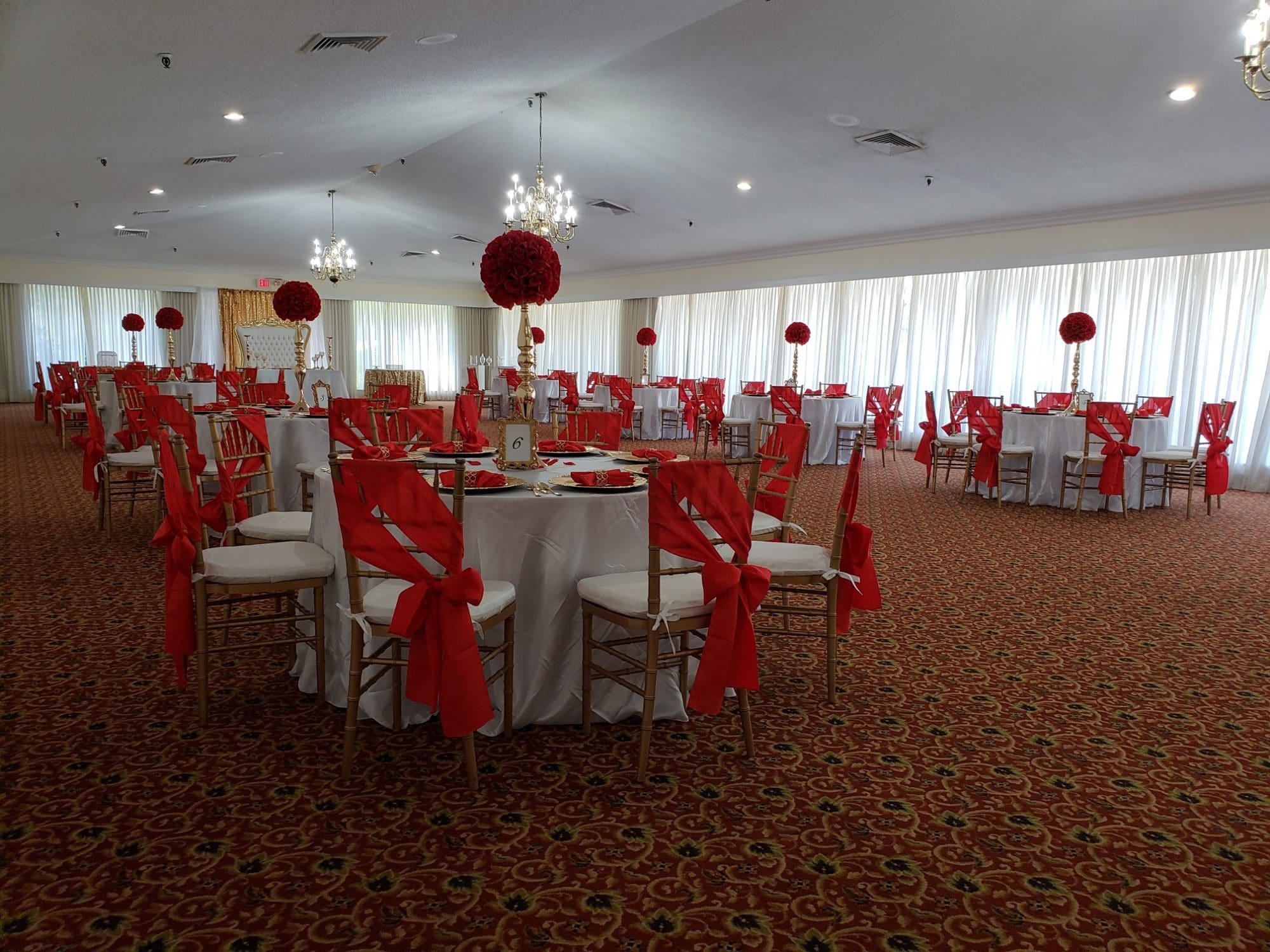 Rio Pinar Golf Club - large reception hall with white and red decor