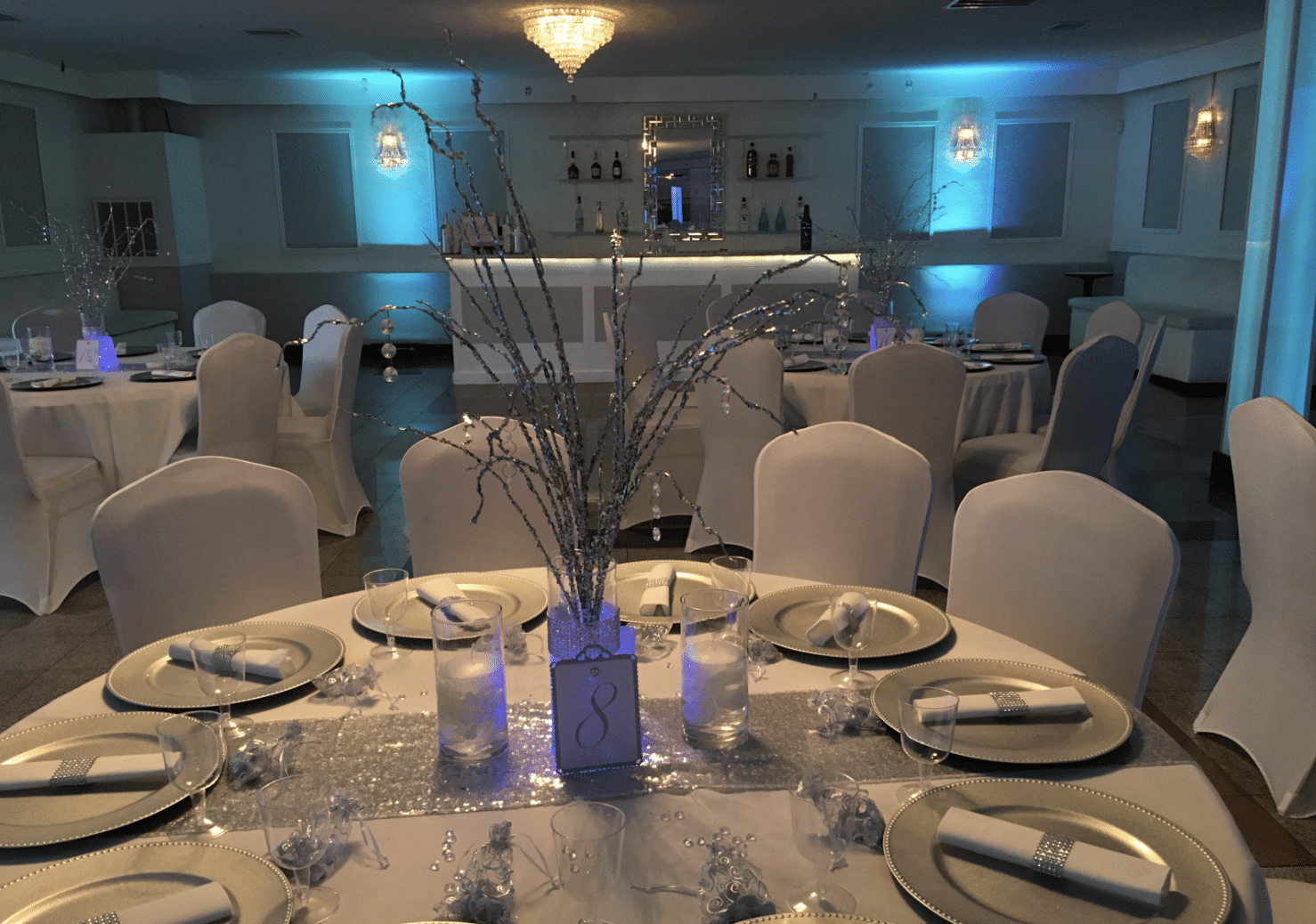 Seaquel Place Banquet Hall - reception table decorated in silver and white