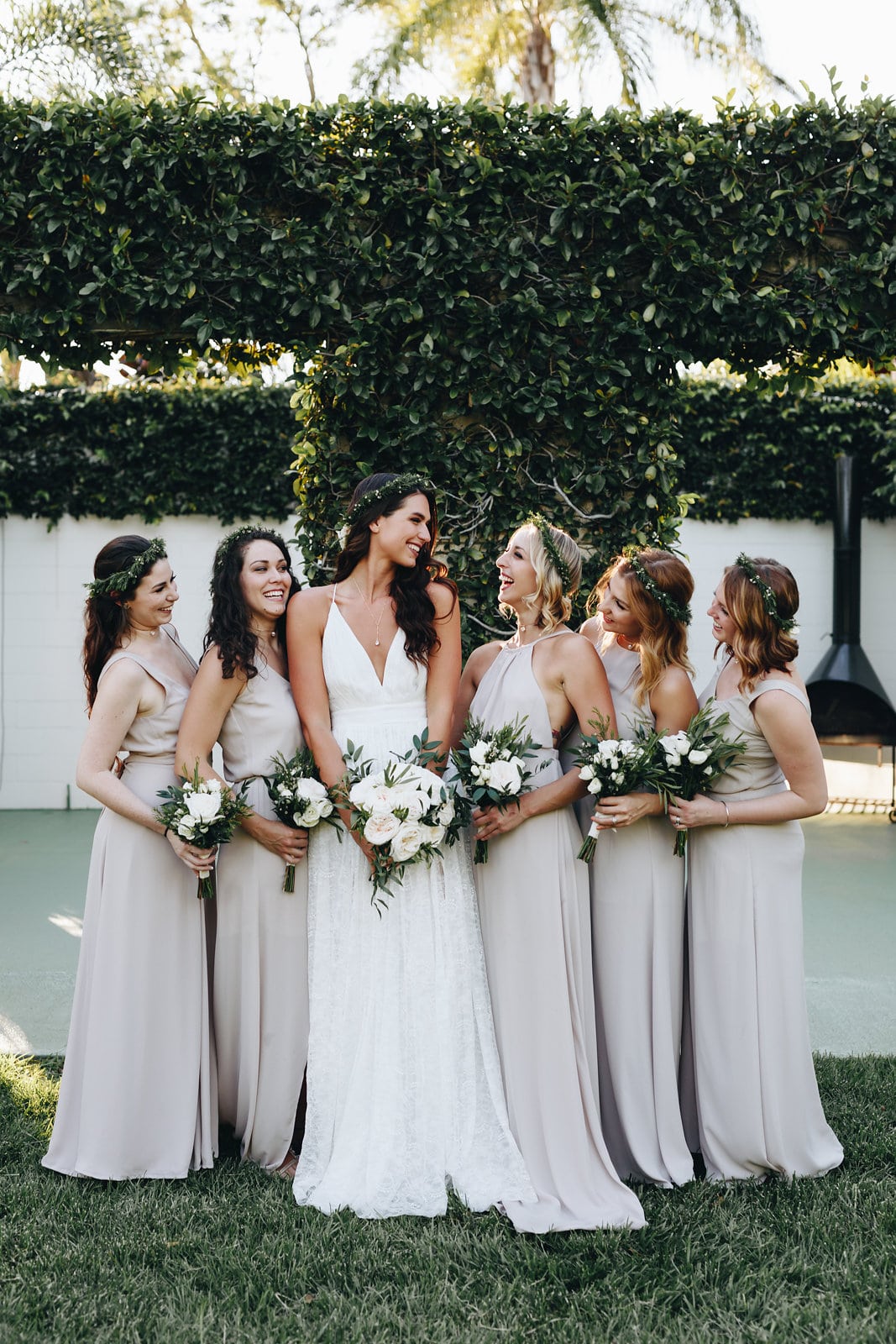 The Acre Orlando - bridal party in front of vine-covered wall