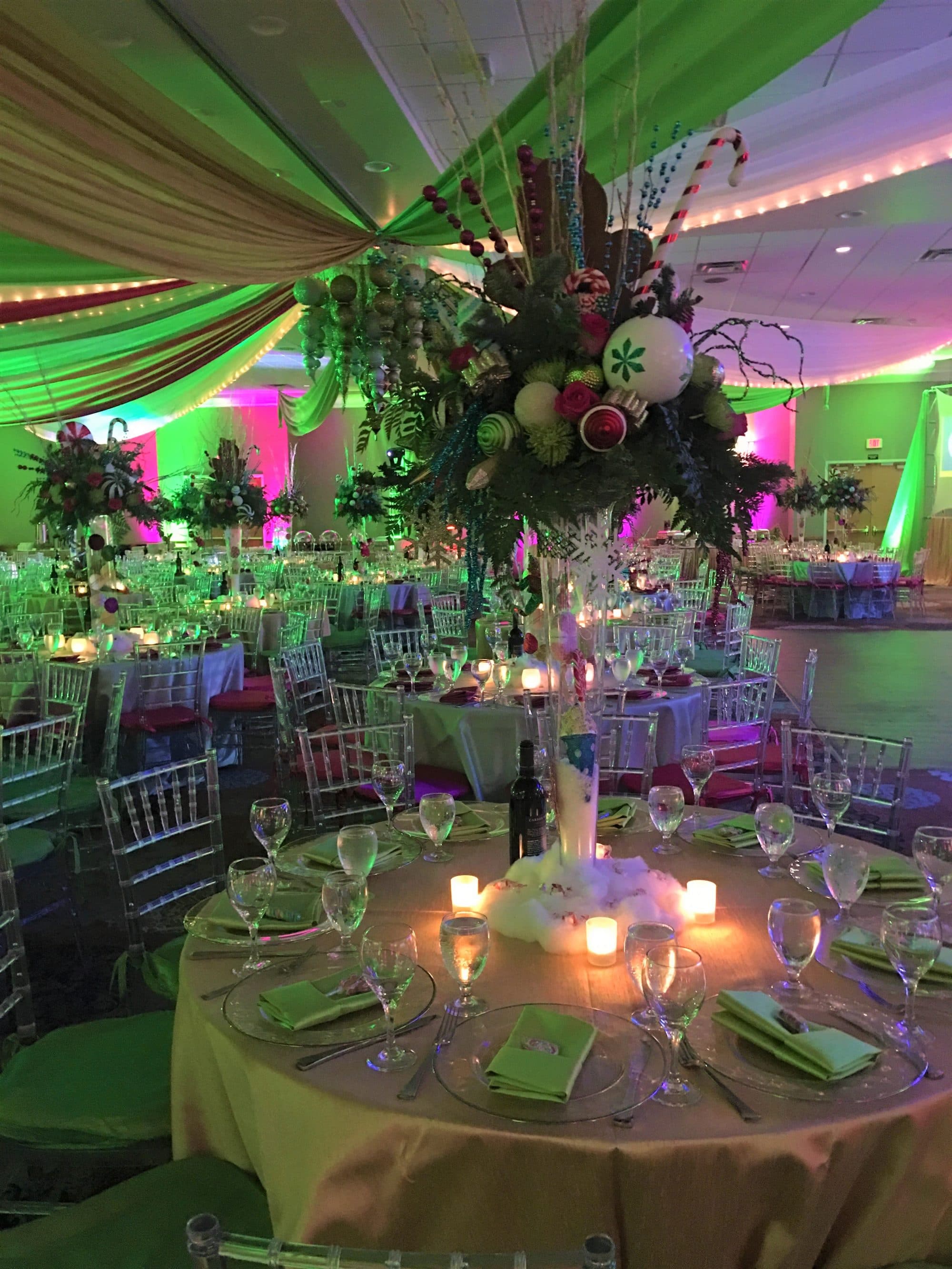 Florida Hotel and Convention Center - Christmas reception with tall centerpieces and green and red ceiling drapes