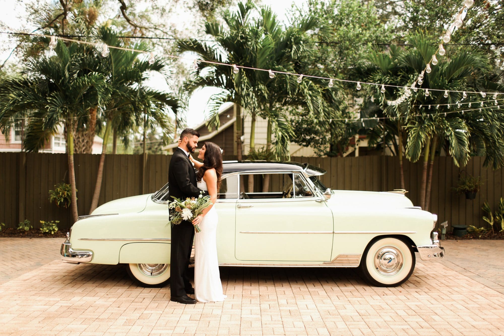 The Veranda at Thornton Park - bride and groom next to classic car at a historic wedding venue in florida