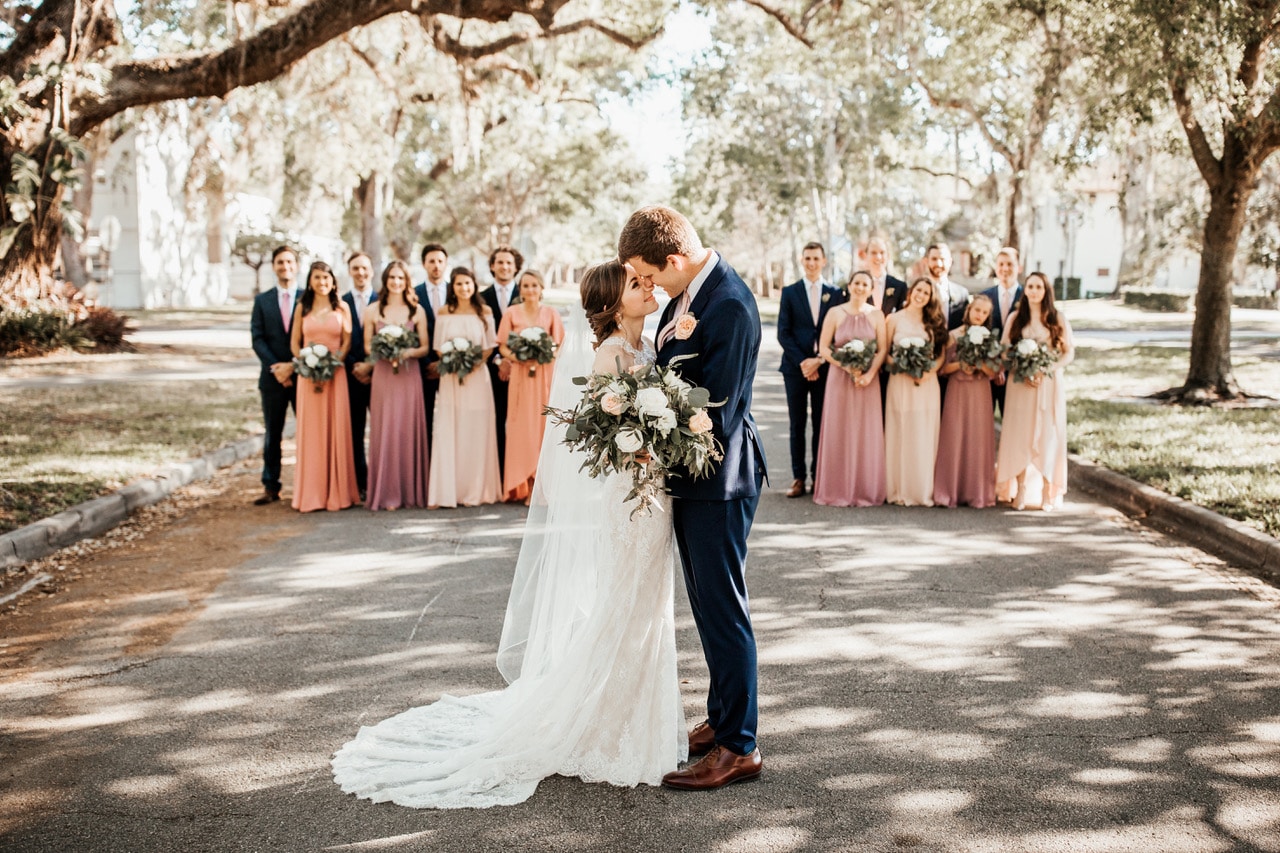 Venue 1902 at Preservation Hall - bride and groom with wedding party on tree-lined street at a historic Florida wedding venue