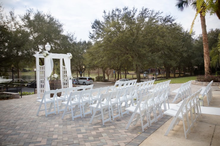 Venue on the Lake - outdoor ceremony setup with white pergola