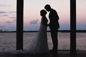 Estate on the Halifax - Silhouette of Bride & Groom on dock by water at dusk
