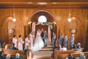 Estate on the Halifax - Bridal party during wedding ceremony indoors wooden church walls