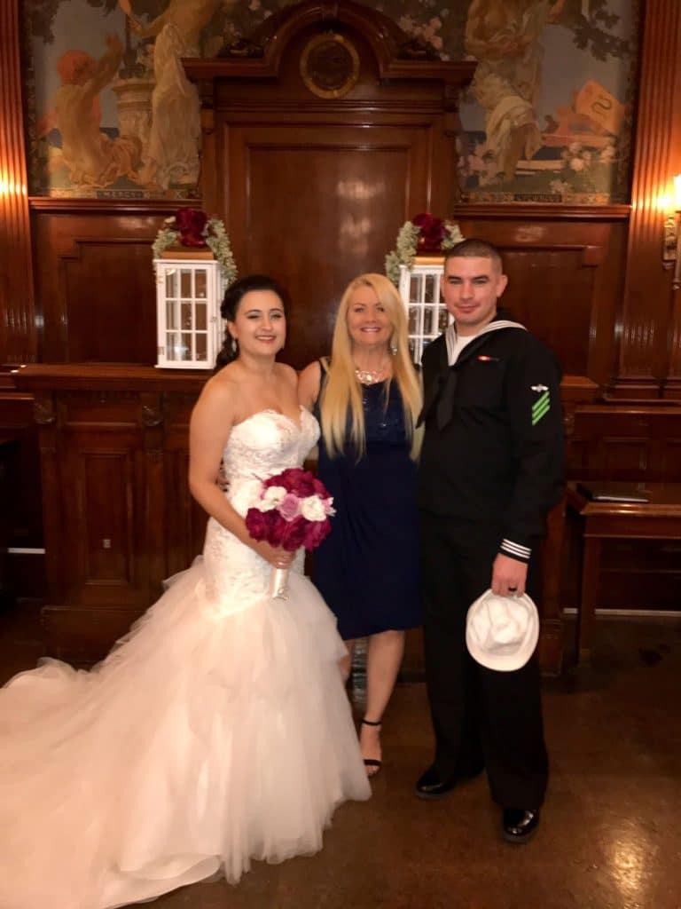 bride and groom in navy uniform with Hearts & Souls Officiant an Orlando Wedding Officiant