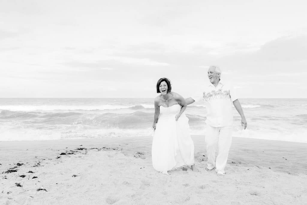 black and white photo of couple just married at the beach by Hearts & Souls Officiant an Orlando Wedding Officiant