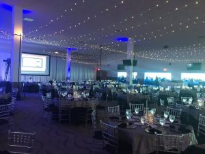 I Rent Everything - reception hall with clear chiavari chairs and fairy lights