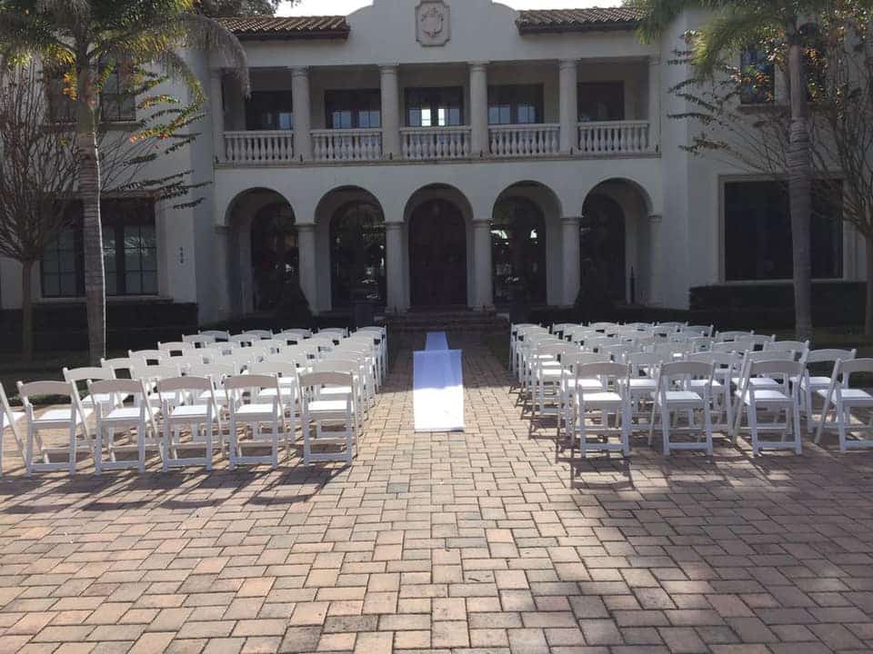 I Rent Everything - white folding chairs set up for ceremony