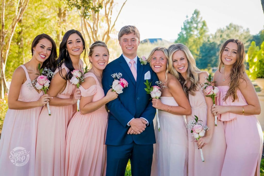 Sugar Pop Productions - bride and groom with happy bridesmaids