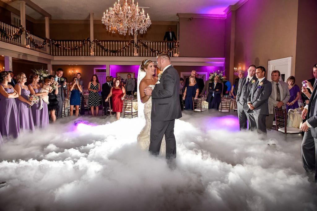 iRock Your Party has a bride and groom dancing on a cloud
