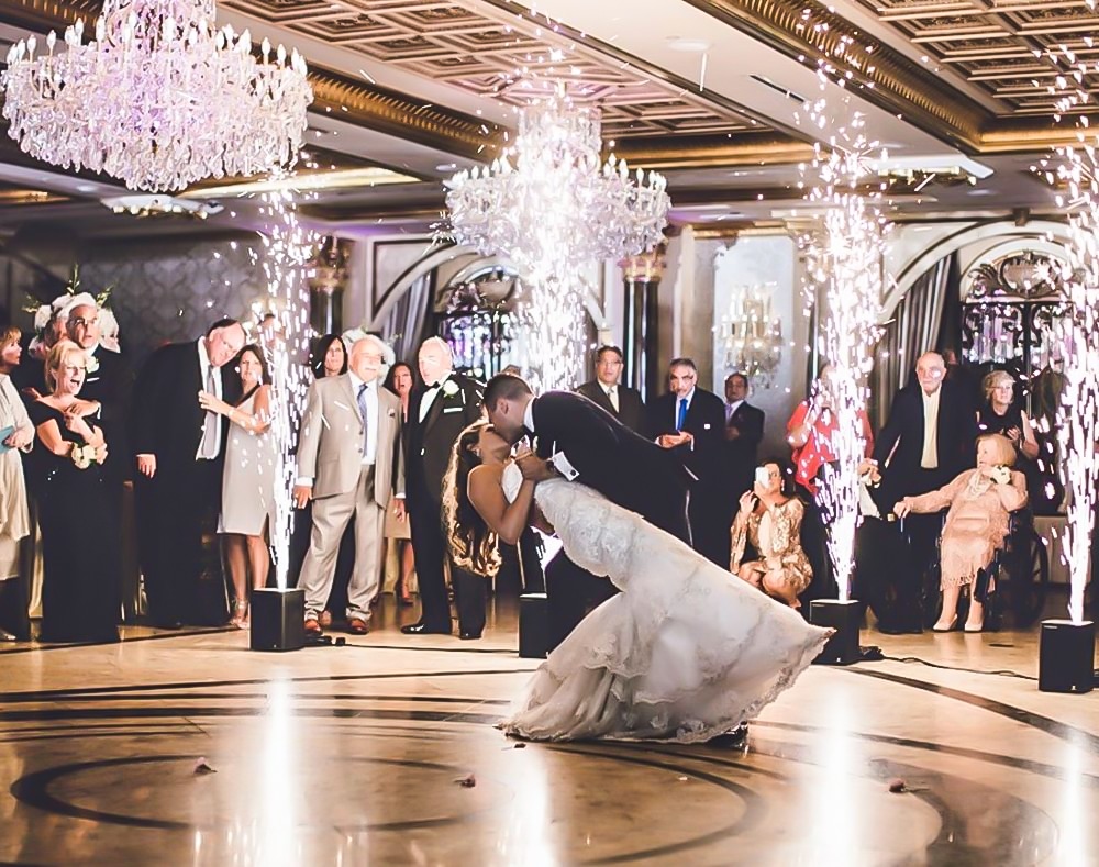 iRock Your Party - groom dipping bride on dance floor with showers of sparks