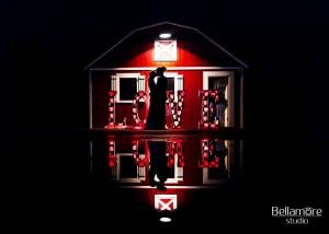 iRock Your Party - bride and groom silhouetted in front of red barn