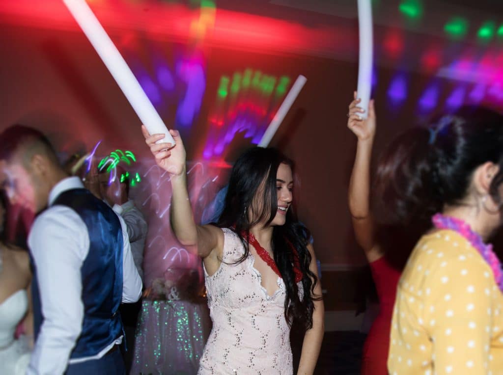 iRock Your Party guests with glowsticks out on the dancefloor