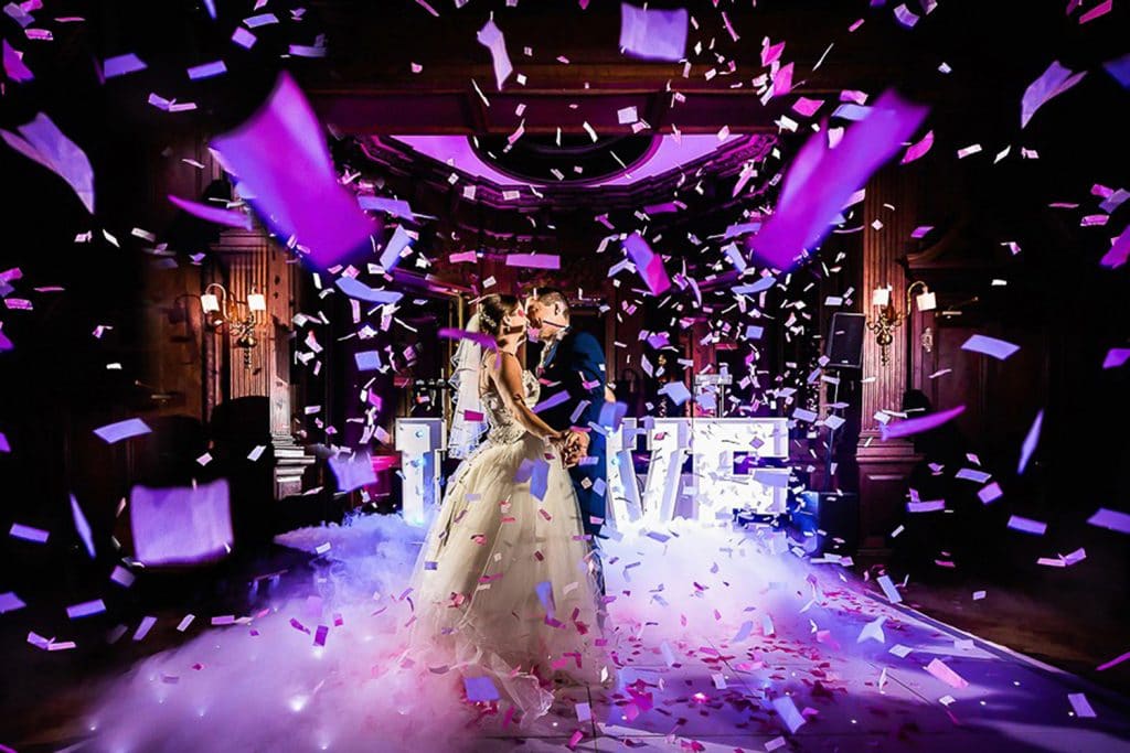 IRock Your Party - bride and groom kiss under confetti