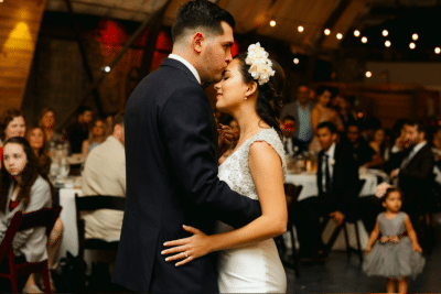 1010-West-Bride and Groom kissing while dancing during reception