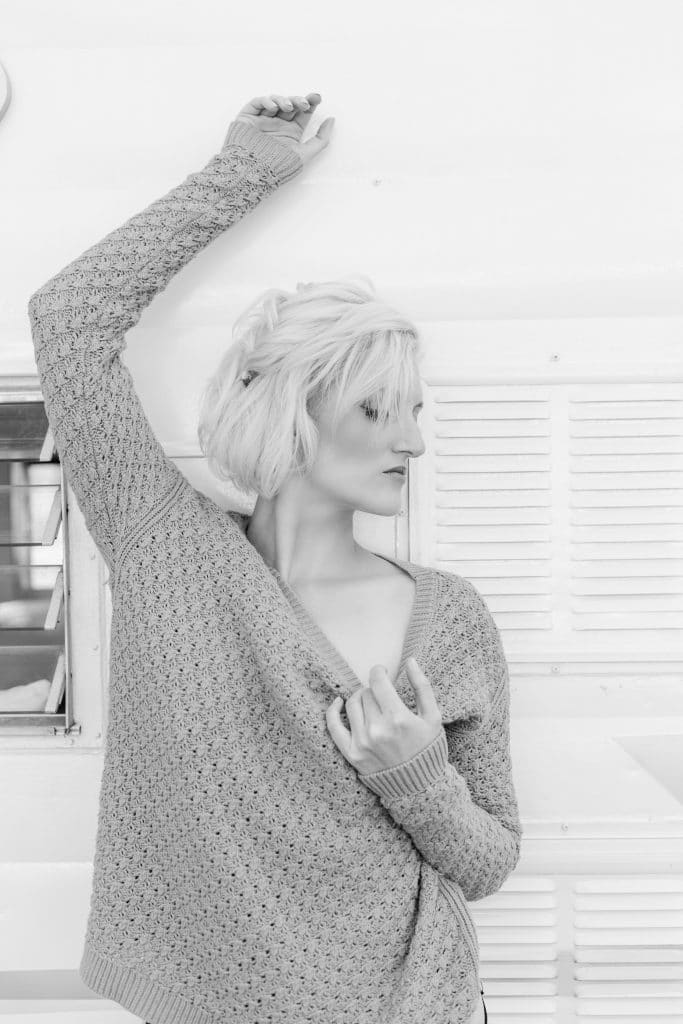 bb by Bumby - sexy photo of woman pulling down neck of sweater
