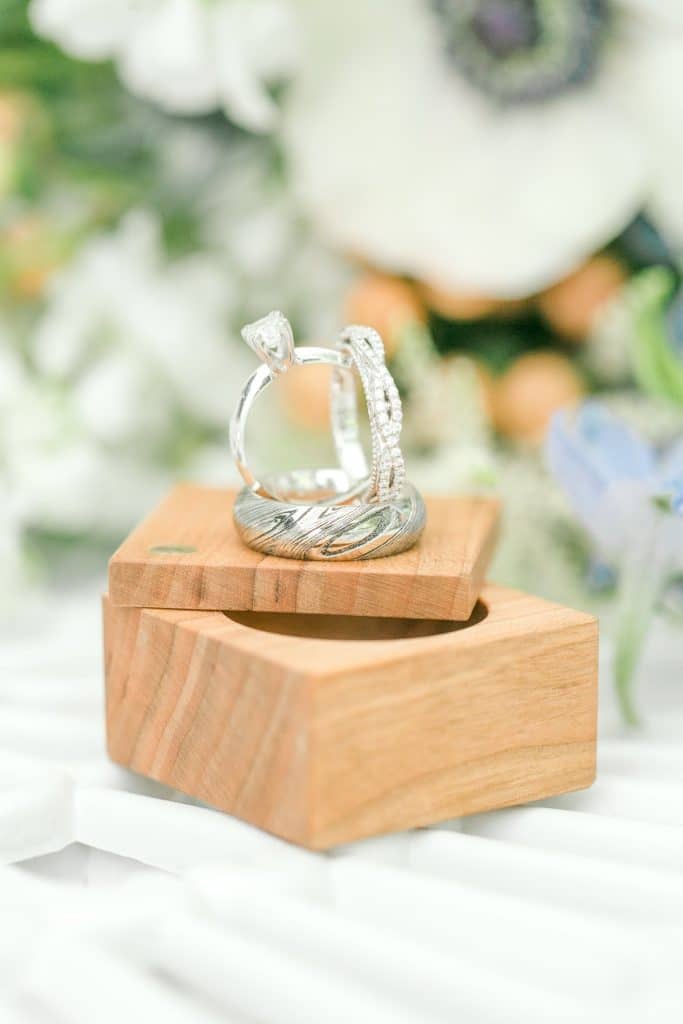 Bumby Photography - wedding rings artfully arranged on cute wooden box