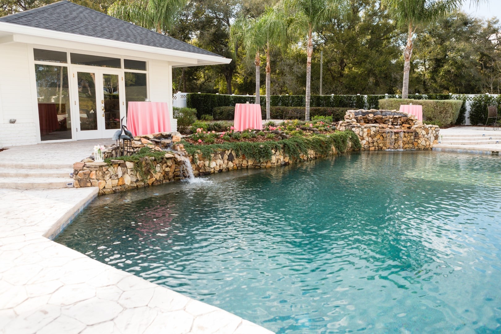 C-Squared-Events-LLC-Pink table surrounding outdoor pool