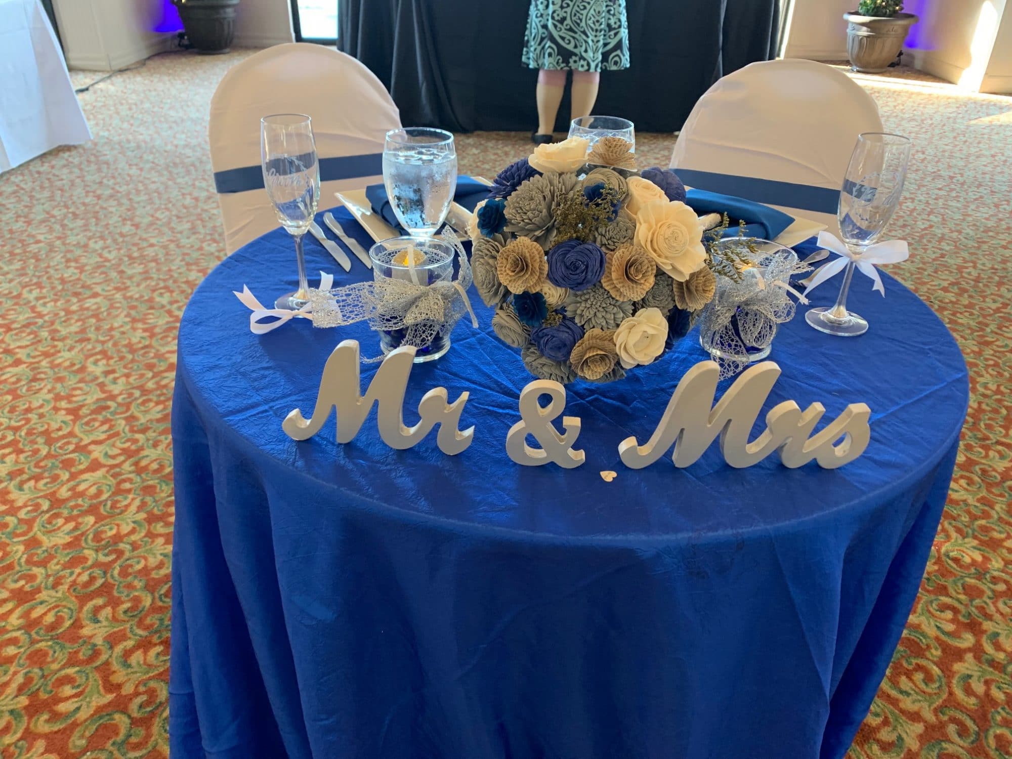 Mr. and Mrs. on blue tablecloth