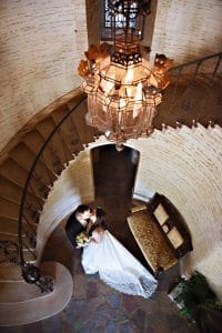 Couple kissing at the bottom of spiral staircase, Rhodes Studios, Orlando, FL