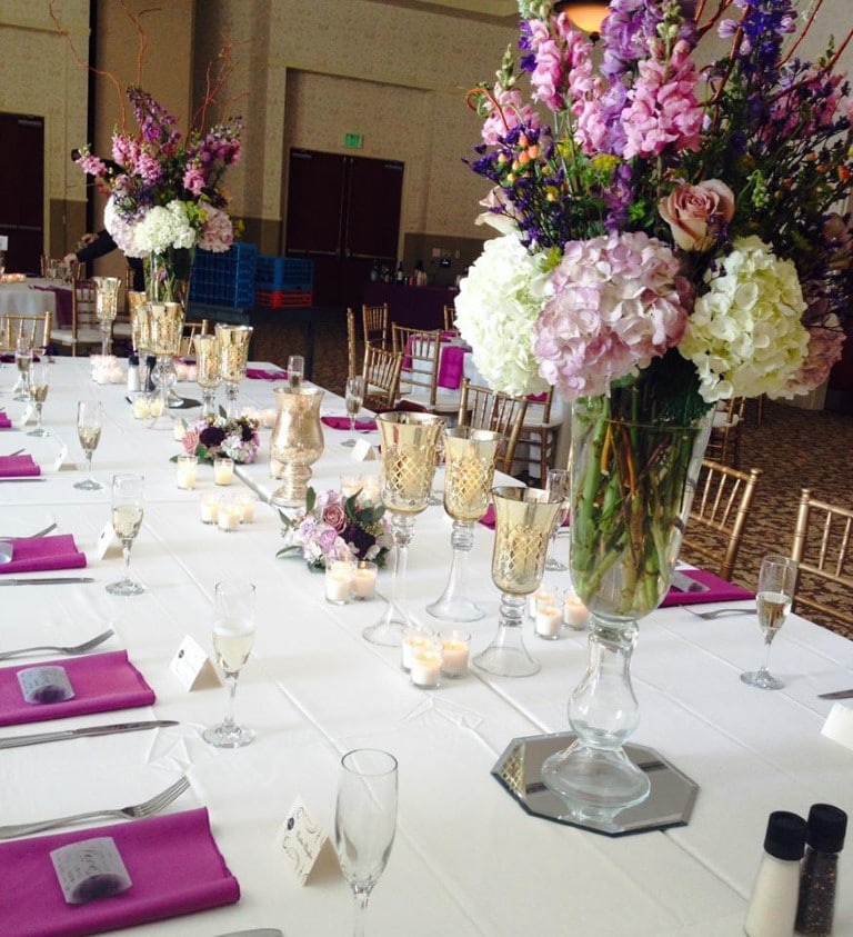 Weddings Inc - Wedding party table setting with shades of lavendar and flower bouquets