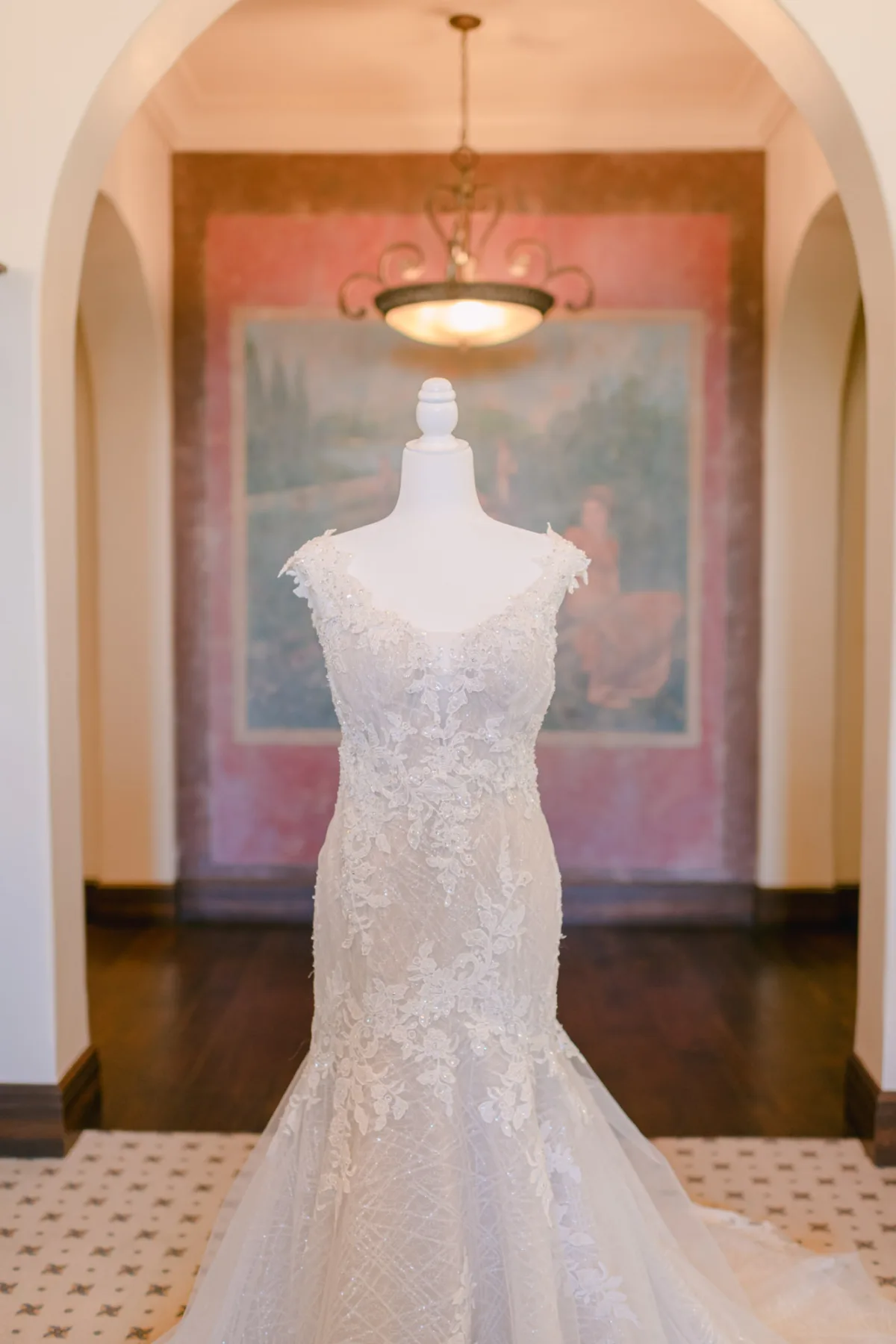 Lace wedding dress on a mannequin inside Bella Collina wedding venue in Montverde, Florida.