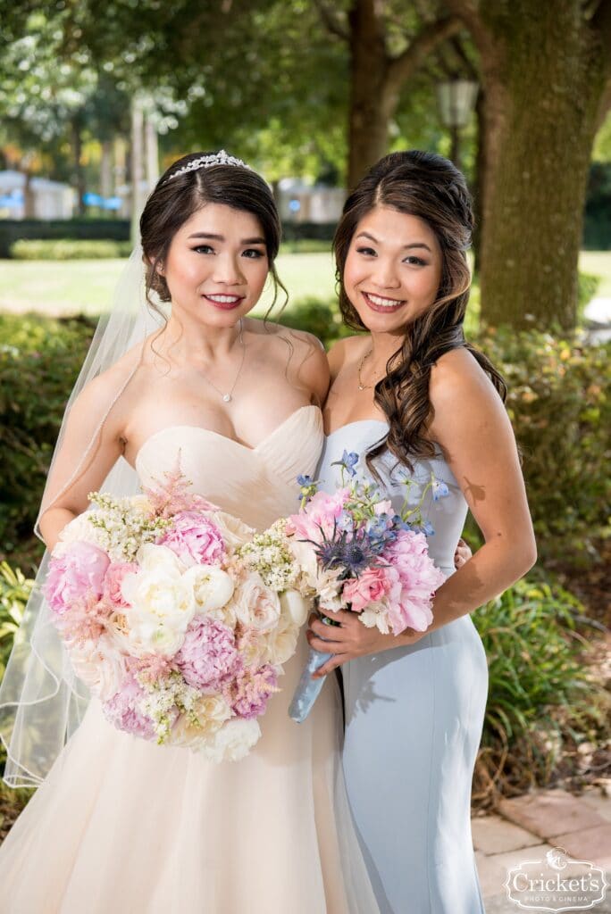 bride standing next to her bridesmaid on her wedding day