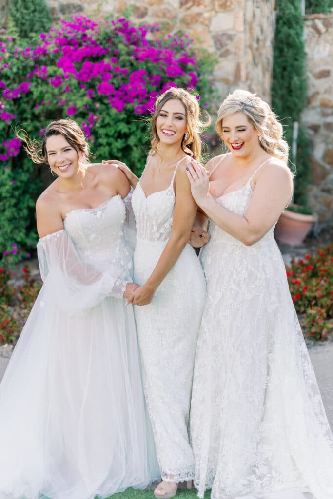 three brides in dresses from Solutions Bridal