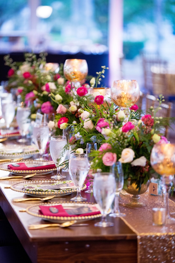 CDC Floral - long reception table with row of small pink bouquet centerpieces