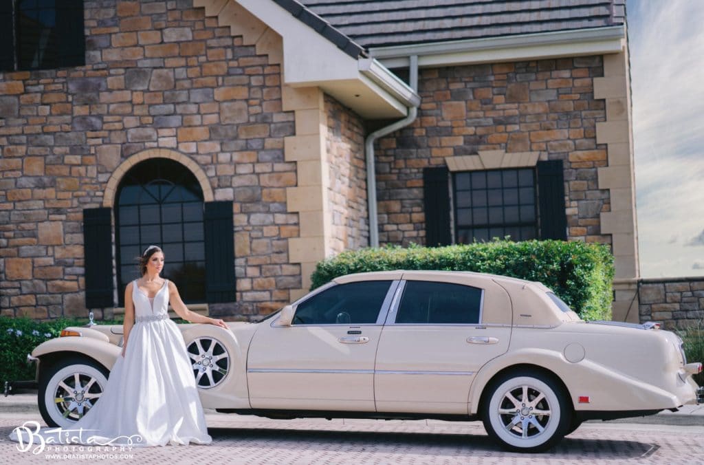 Exotic-Limo-Orlando-Bride next to excalibur godfather car