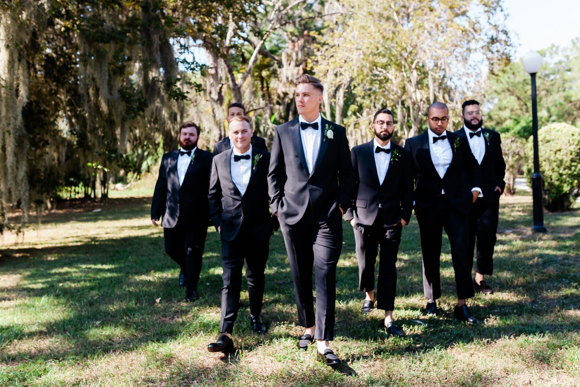 For the Love of Events - groom and groomsmen walking through field