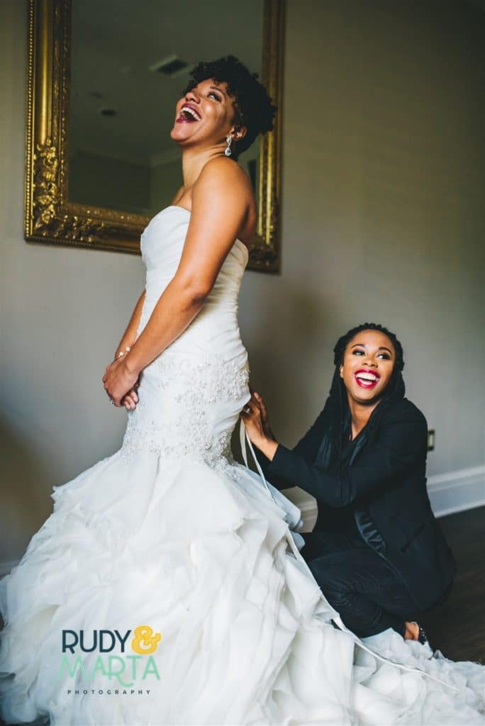Live-Love-Laugh-Events-Bride getting her wedding dress on with help