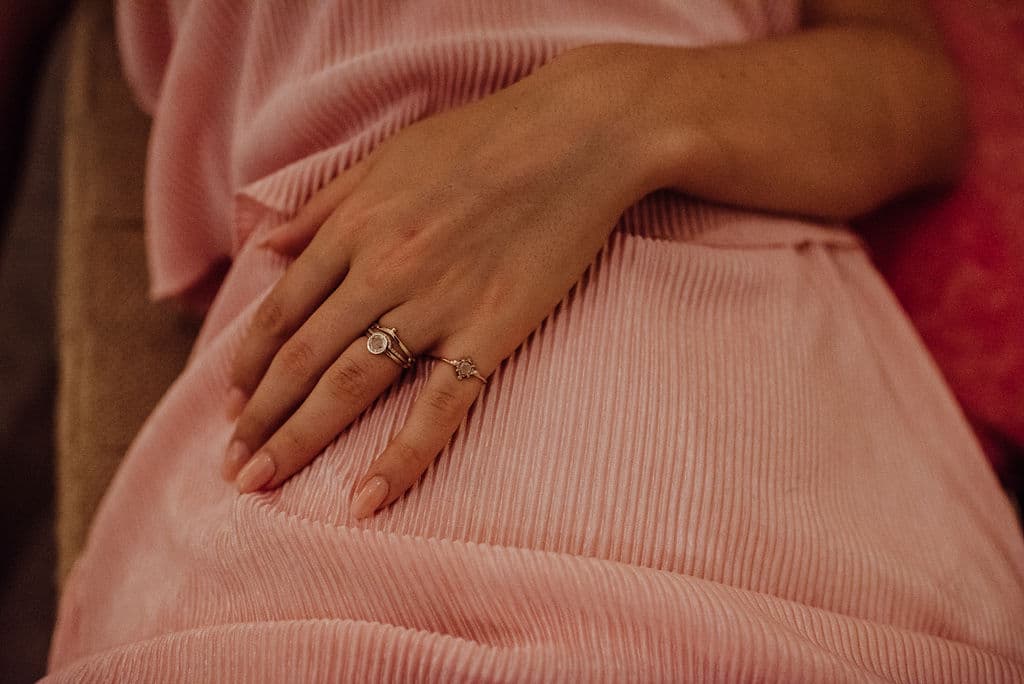 Sandy Rubin Jewelry - gold rings on woman's hand