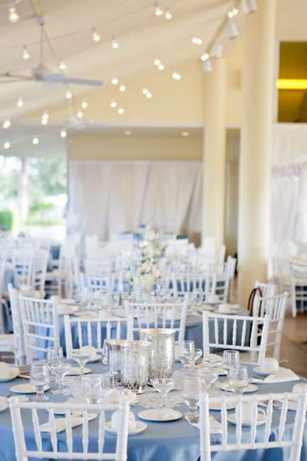The Villages Polo Club - all-white wedding reception with blue table linens