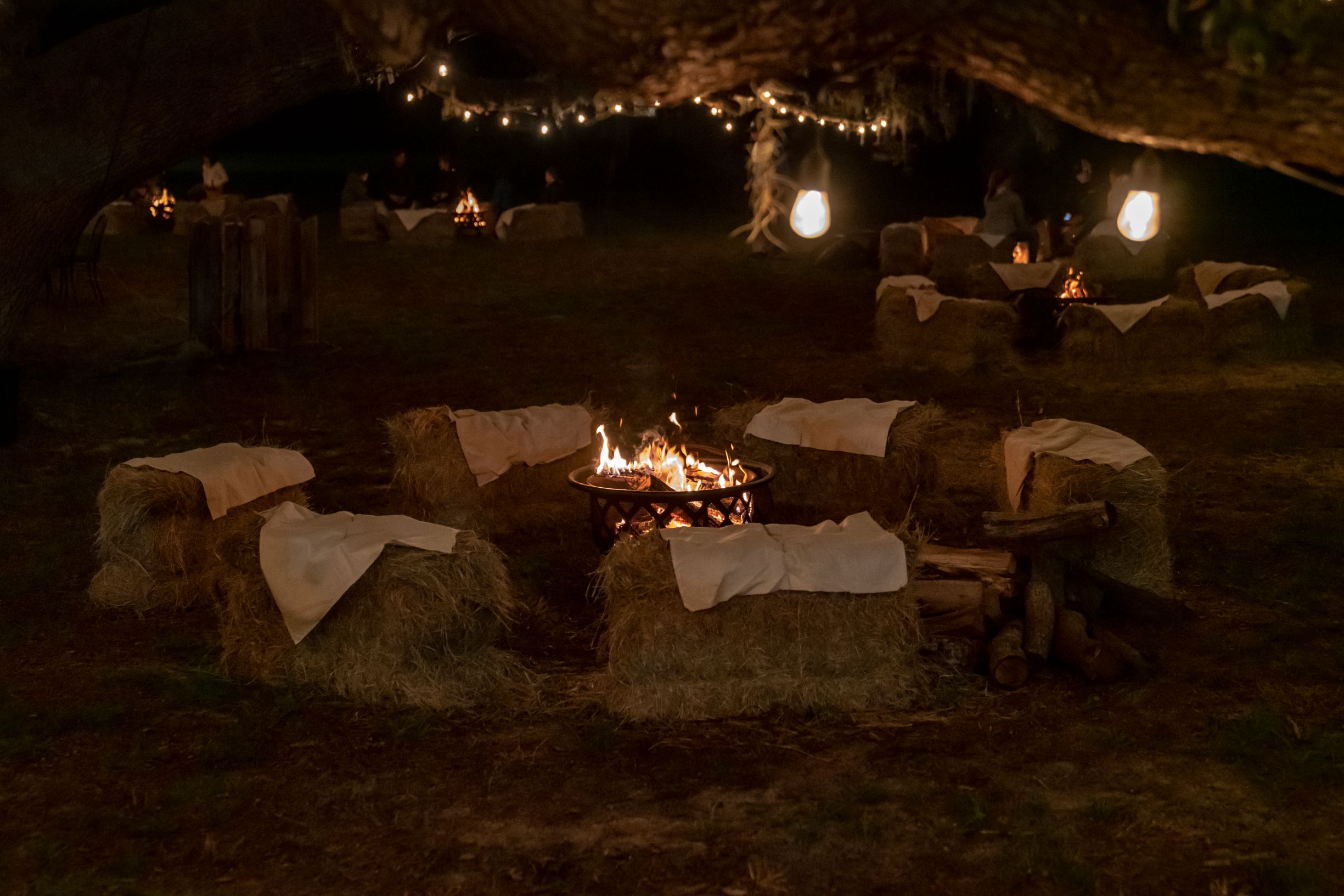 The Villages Polo Club - outdoor fire pit surrounded by hay bales