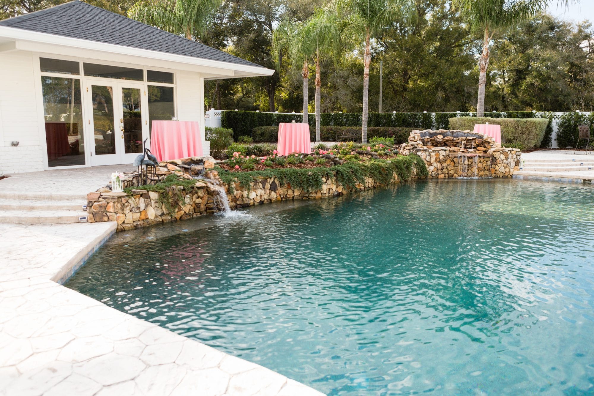 C Squared Events - outdoor pool surrounded by rocks and florals