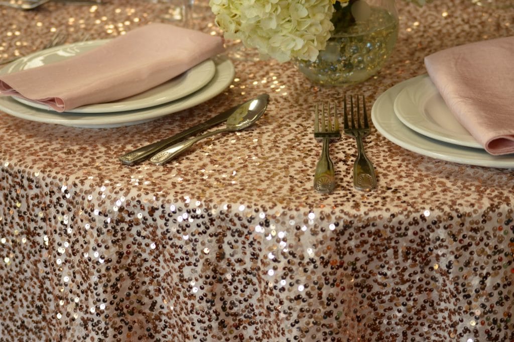 Connie-Duglin-Linen-Gold sequin linen with pink napkin and gold accents