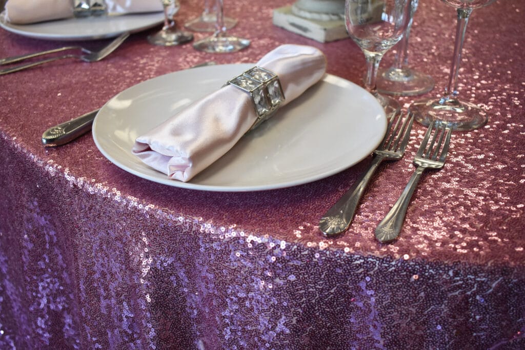 Connie Duglin Linen Rentals pink sparkly tablecloth and napkins