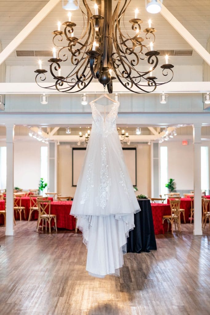 Idlewood Wedding Venue brides dress hanging inside empty reception room