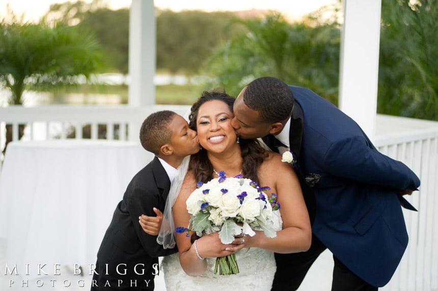 Live Love Laugh Events - boy and groom kissing bride's cheeks