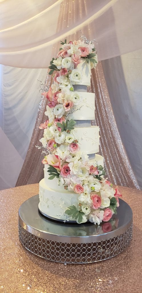Sofelle Cake Artistry - five-tiered wedding cake with gorgeous blooms