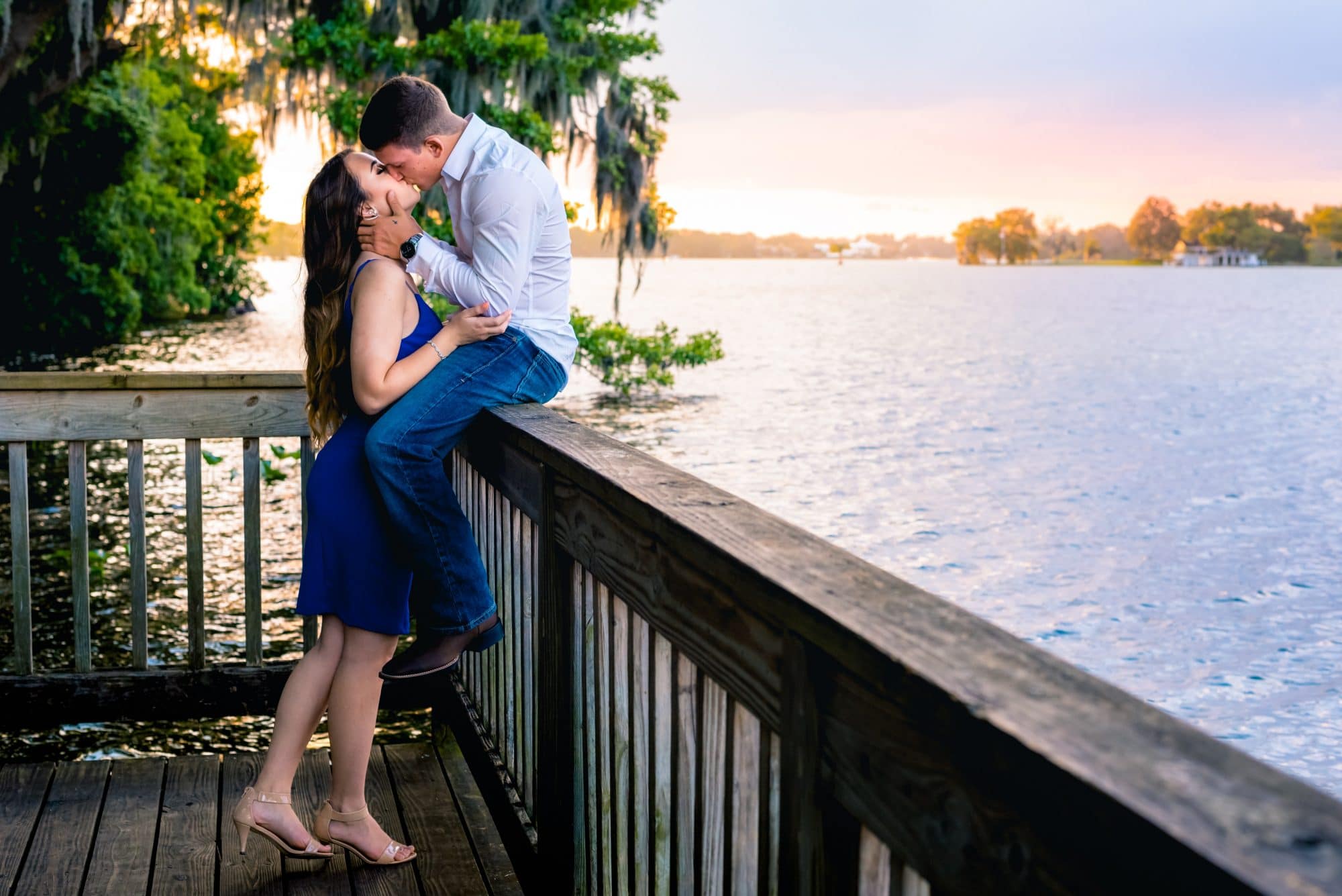 Embrace-by-Kara-Couple kissing on a dock at sunset