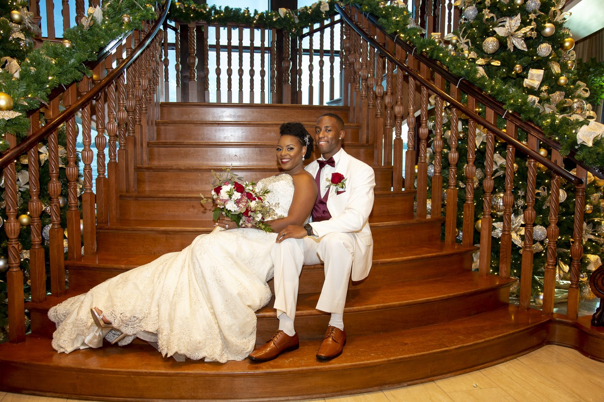 Shaneika and Richard lounging on gorgeous wood staircase