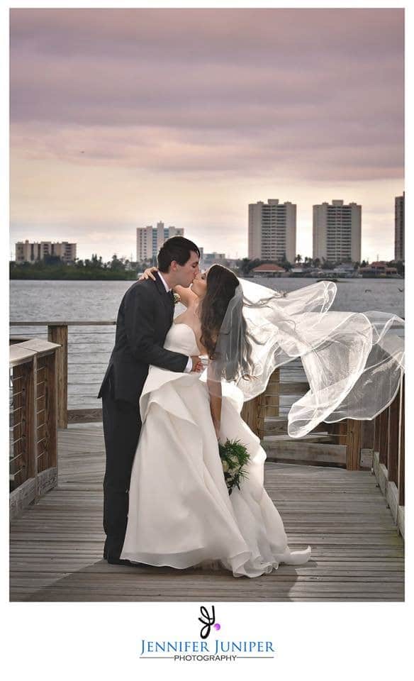 riverside-pavilion-Husband kissing Wife on the dock