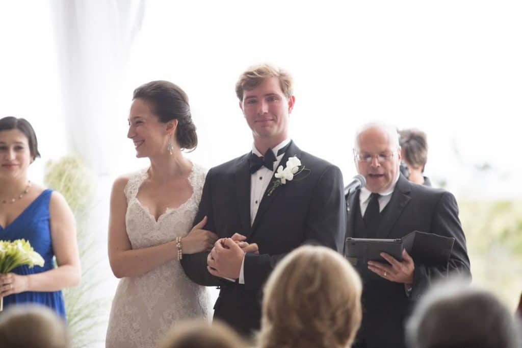 Pastor-Mike-Weddings-Bride and groom walking arm in arm down the aisle.